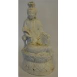 A large carved immortal figure on carved base. Est