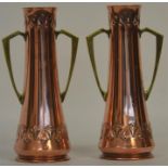 A stylish pair of copper and brass baluster shaped