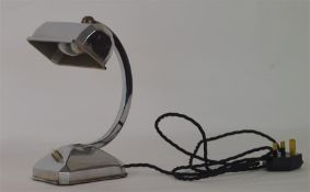 A stylish chrome lamp with a panelled shade and pu