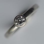 A small platinum single stone ring, the central di