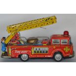 A mechanical toy in the form of a fire engine. Est