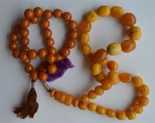A graduated string of amber type beads with tassel