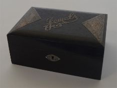 An attractive ebony and silver mounted box with en