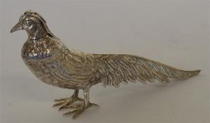A Continental figure of a bird with textured body.