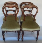 A set of four hoop back dining chairs on turned su