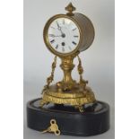 A French brass clock by LeRoy decorated with flowe