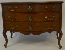 A good Continental three drawer chest with wavy de