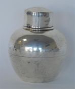 A small circular tea caddy with lift off cover. Bi