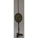 An Antique mahogany pole screen with tapestry deco