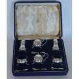A good boxed six piece cruet with matching spoons