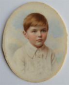 An attractive oval miniature of a boy with blue ba