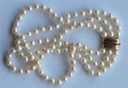A good quality pearl three strand choker with high