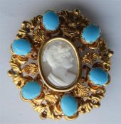 An oval turquoise mounted shell cameo of a lady's