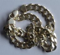 A heavy silver curb link necklace with ring clasp.