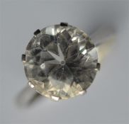 A large single stone ring in 18 carat and platinum