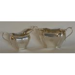 A good quality cream and sugar basin with canted c