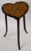 An attractive inlaid heart shaped occasional table