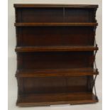 A good rosewood bookcase with brass string inlay.