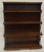 A good rosewood bookcase with brass string inlay.