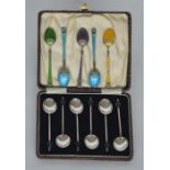 A boxed set of six bean top coffee spoons together