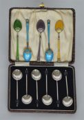 A boxed set of six bean top coffee spoons together
