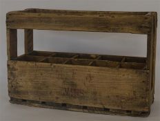 An unusual rustic wooden ten bottle crate. Est. £2