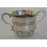 A good half fluted porringer embossed with flower