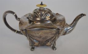 A stylish baluster shaped teapot with chased decor