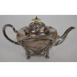 A stylish baluster shaped teapot with chased decor