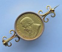 An 1895 gold pond coin mounted as a brooch. Approx