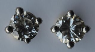 A small pair of diamond brilliant cut ear studs in