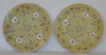 A pair of Chinese yellow ground plates with floral