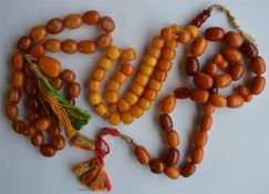 A group of three good yellow stone necklaces with