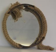An attractive circular mirror with rope frame. Est