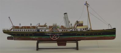 A large model of a paddle steamer on stand. Est. £