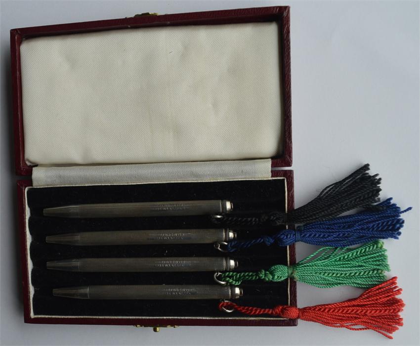 A good set of four engine turned bridge pens with