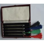 A good set of four engine turned bridge pens with