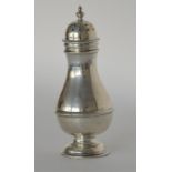 A tall baluster shaped caster on pedestal base. Lo