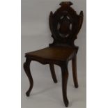A Georgian shield back oak hall chair. Est. £20 -