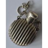 A small reeded scent bottle with hinged top and su