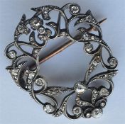 A scroll decorated Antique diamond brooch decorate