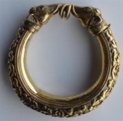 A good quality silver gilt hinged bangle, heavily