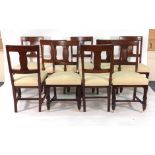 A set of nine late 19th century mahogany and upholstered dining chairs on turned front legs