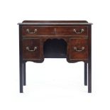 A George III mahogany lowboy, the three drawers around a shaped apron on square straight legs, w.