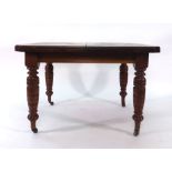 A late 19th century walnut extending dining table, with one fitted leaf, on turned feet, max. l.