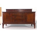 A late 19th/early 20th century Chippendale-type mahogany sideboard with an arrangement of three