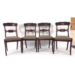 A set of four Regeny mahogany and upholstered dining chairs on sabre legs CONDITION