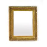 A 19th century mirror, the rectangular plate within a gilt plaster frame,