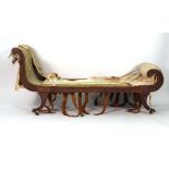 For Restoration: a Regency walnut and upholstered day bed of scrolled form,