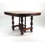 A late 19th century walnut extending dining table with two fitted leaves on a turned substructure,